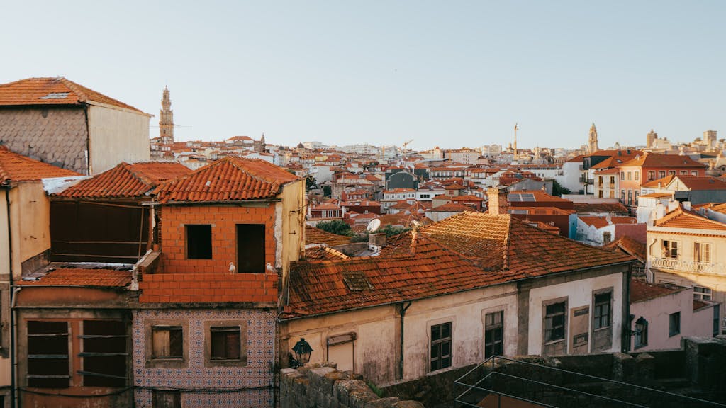 Charming rooftop view showcasing the historic architecture and cityscape of Porto, Portugal at daytime.