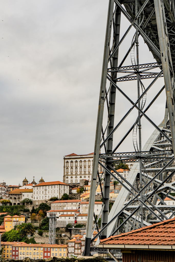 View of Dom Luís I Bridge with Porto's colorful cityscape in Portugal.