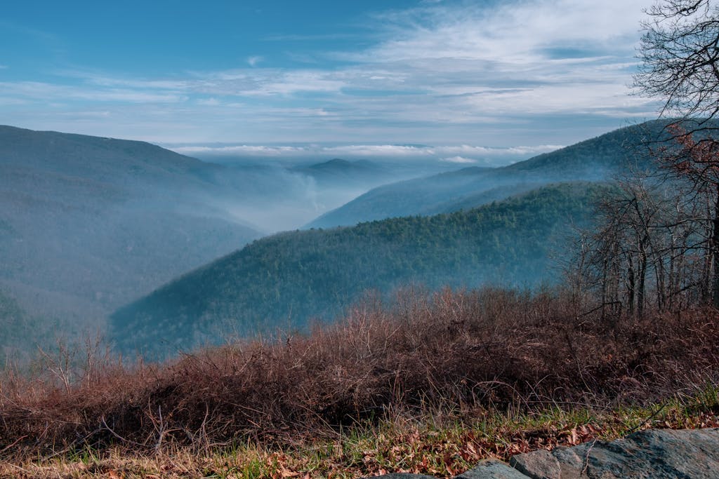 Capture of Shenandoah's misty mountains under a clear blue sky in Virginia, USA.